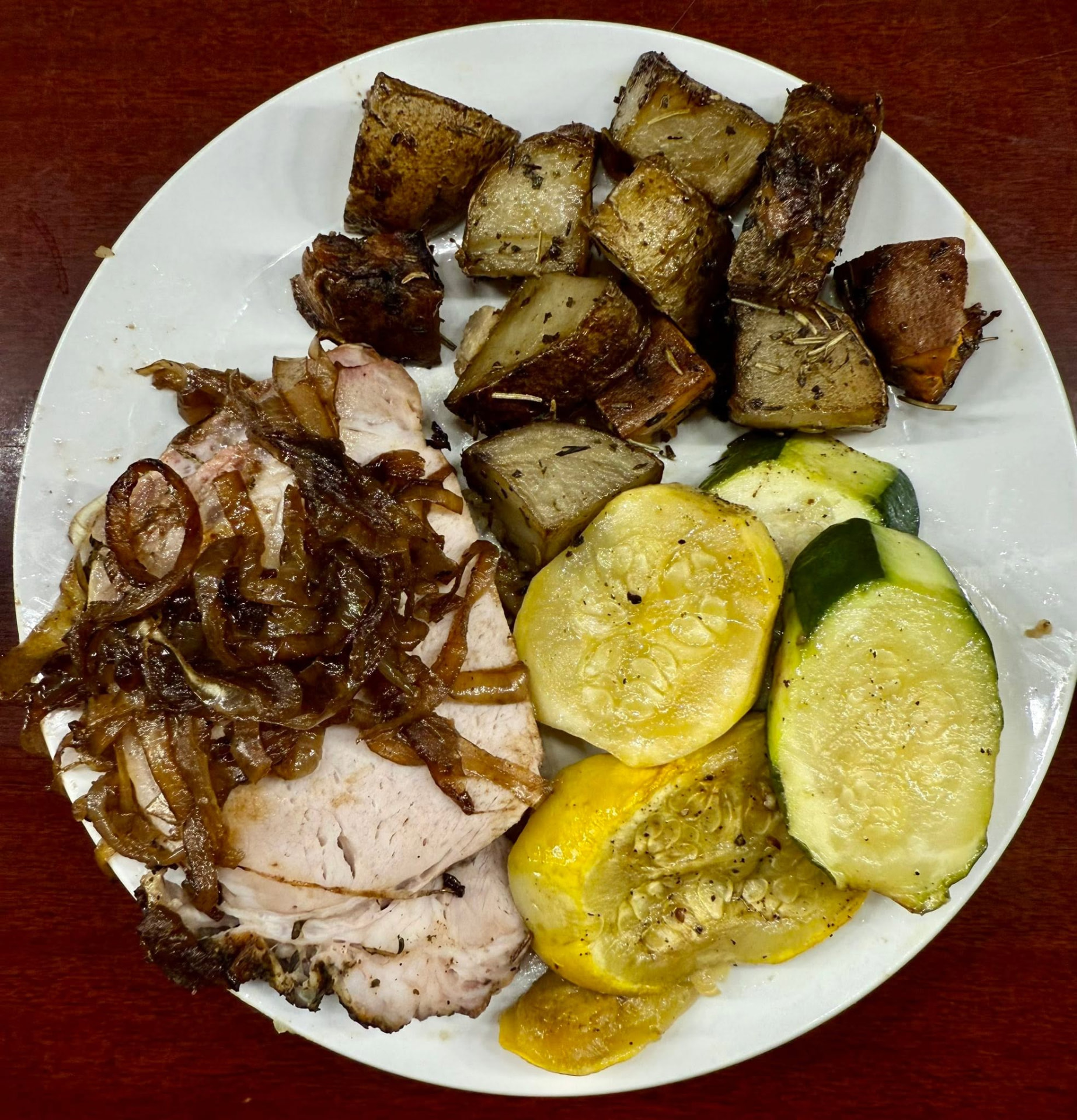 Roast pork with caramelized onions, potatoes and squash